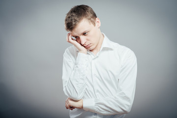 Obraz premium Young Man wants to sleep. Put his head in his hands