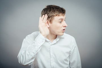 young man which overhears conversation - 340044709