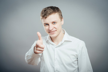 young  man pointing at someone gesture with finger