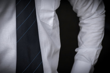 Mans shoulder and half body with a tie and white shirt,Formal outfit
