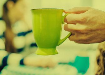 Hand with  cup of coffee