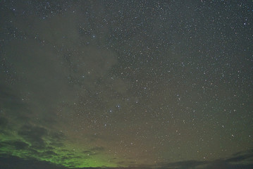 Aurora in the cloudy night
