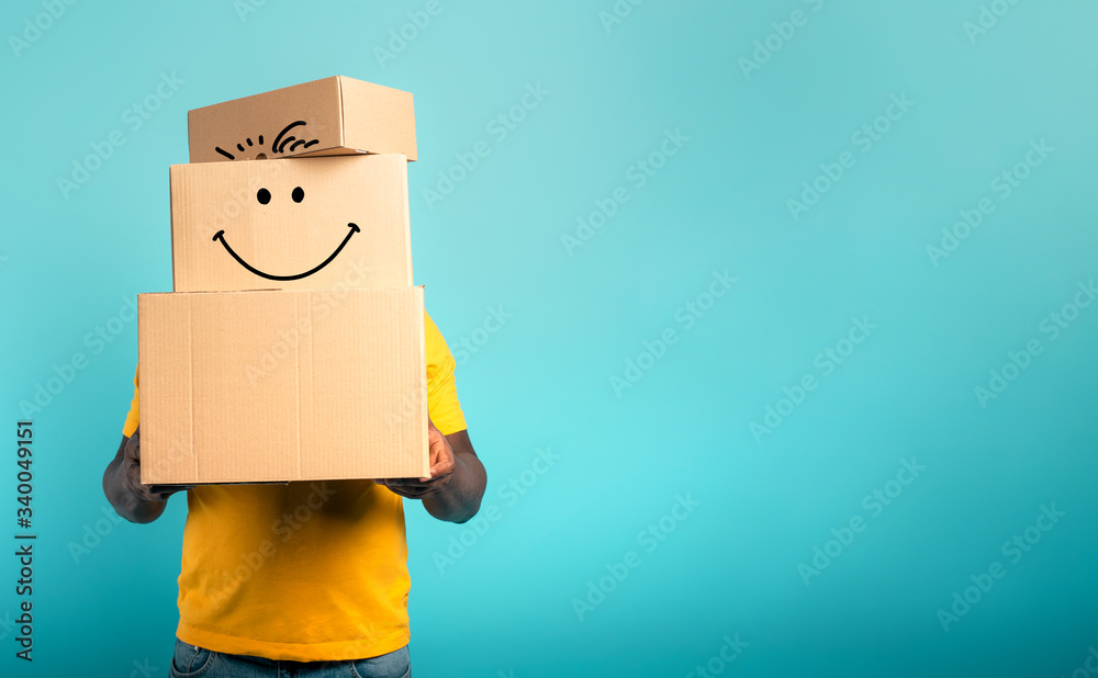 Wall mural Man is hidden by too many received packages. Cyan background