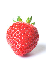 Fresh ripe red strawberry with green leaves on white background with dropped shadow. Studio shot