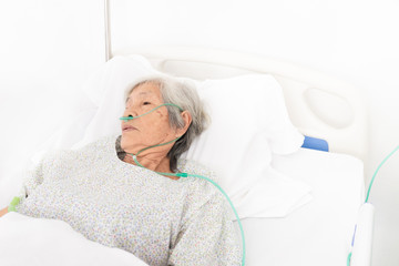 palliative care,  old Asian patient wear oxygen cannula and sleep on white bed, she feeling lonely,...