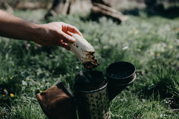 Chimney for flashing bees. Chimney stands near beehives.The beekeeper's tool. Bee smoker smoking.