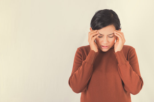 Asian woman is standing headache On the background .