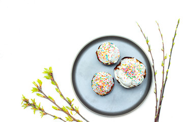 Easter cakes on a gray plate. Religious holiday. Place under the text. Easter banner. Frosting on the sandwich.