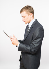 businessman at the table uses a digital tablet