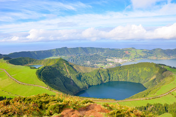 Viewpoint Miradouro da Boca do Inferno in Sao Miguel Island, Azores, Portugal. Amazing crater lakes surrounded by green fields and forests. Beautiful Portuguese landscape. Tourist destination