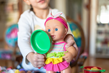 little girl plays cooking