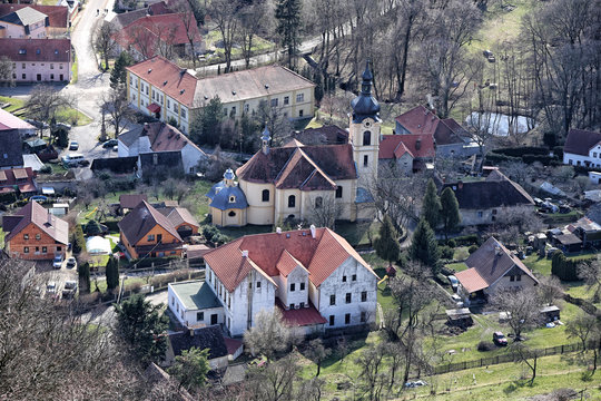 Aerial image of small village with church, farms and houses