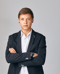 Portrait of young very serious businessman