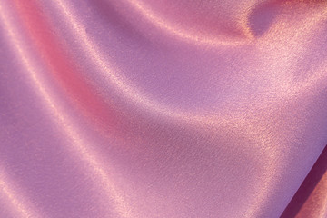 Beautiful horizontal texture of pink silk curtain fabric or textile for hand made sewing