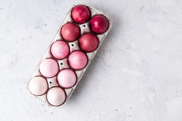 Stylish eggs with ombre pink  effect on white background. Natural ecological staining with food coloring