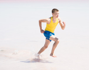 running man in water of sea