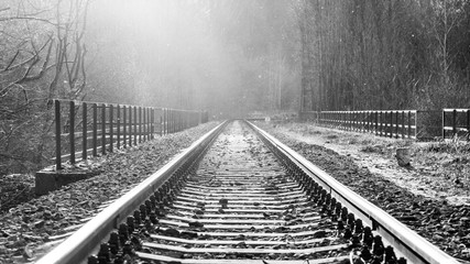 Fototapety  Dream journey. Railroad tracks at sunset time. Summer haze