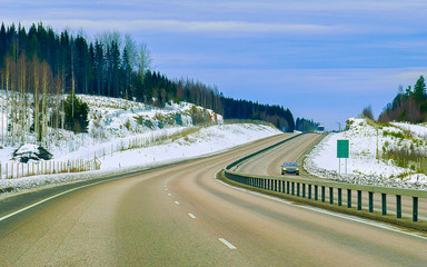 Obraz premium Winter road on Snow Forest at Cold Finland in Lapland reflex