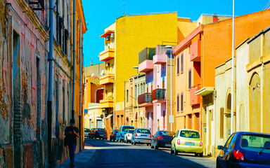 Fototapeta na wymiar Street view on Road with car parked in Cagliari reflex