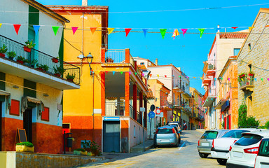 Fototapeta na wymiar Street with road in Arzachena Sardinia reflex
