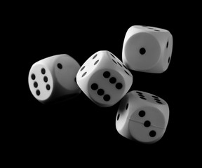 White playing, gambling die, dice for tabletop games and poker isolated on black background with clipping path