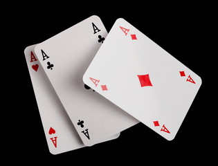 Classic playing cards, aces for poker, gambling and casinos isolated on black background with clipping path