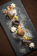 Homemade chocolate candies with almond cookie crumbs