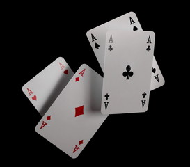 Classic playing cards, aces for poker, gambling and casinos isolated on black background with clipping path