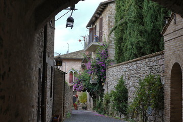 Fototapeta na wymiar Assisi, Italy - 11/30/2019: The streets of the medieval village of Assisi