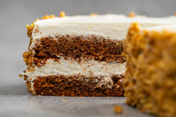 nut cake with cream on a gray background