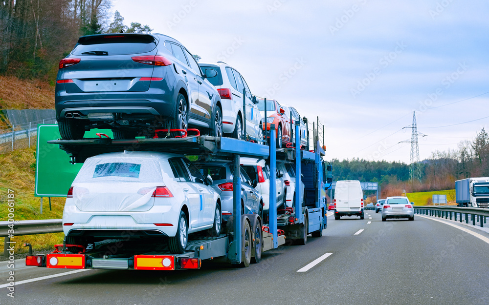 Wall mural car carrier transporter truck on road reflex