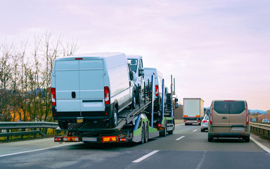 Minivan carrier transporter truck in road Auto vehicles reflex