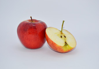 
red, ripe apples on a white background. apples are a source of vitamins and iron during quarantine and self-isolation