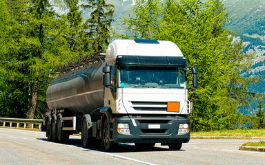 Truck on road at Visp Valais canton Switzerland reflex