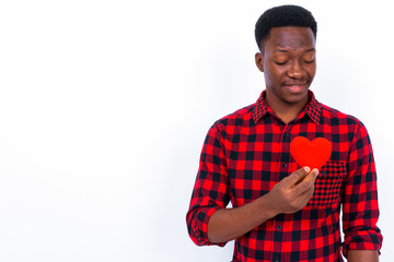 Young handsome African man against white background