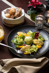 Salad with shrimp mousse, peach, quail egg