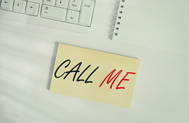 Text sign showing Call Me. Business photo showcasing Asking for communication by telephone to talk about something Empty note paper on the white background by the pc keyboard with copy space