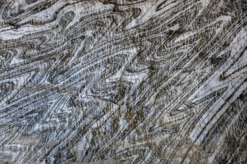 Abstract gray texture of natural, raw salt in an underground salt mine