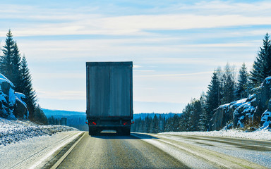 Truck on road at winter Rovaniemi reflex
