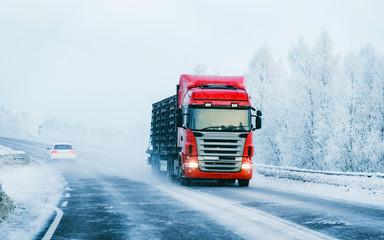 Truck on the Snowy winter Road of Finland Lapland reflex