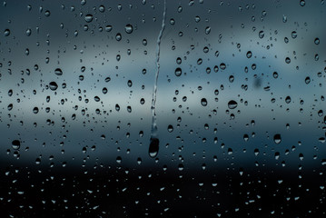 Naklejka na ściany i meble rain drops on window, water drops on window