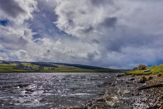 Grassholme Reservoir by waters edge on summers day                          
