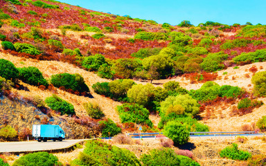 Truck on beautiful road in Teulada Cagliari Sardinia reflex