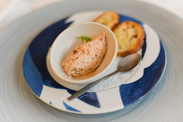 Salmon pate for an aperitif in a restaurant