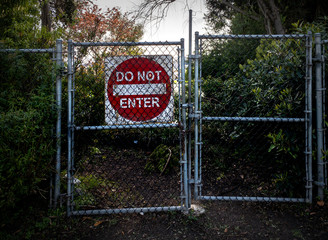Do Not Enter Sign Behind Chainlink Fence