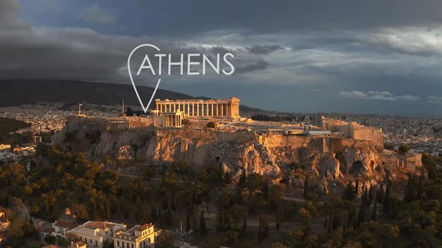 Aerial establishing shot of Athens involving famous Acropolis with city geotag, Greece