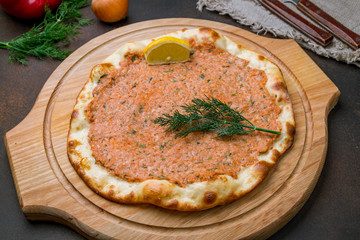 lahmacun Turkish cuisine on brown concrete table