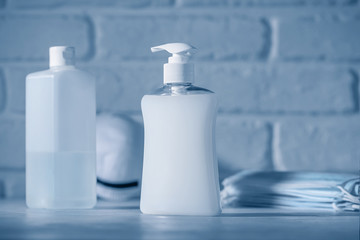 Medical masks and hand sanitizer gel for hand hygiene. Corona virus protection