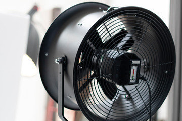 Isolated image of a fan working against a white background