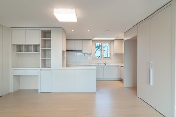 Interior of an empty kitchen in a new apartment. 
New apartment interior in South Korea.